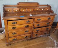 Front view showing all drawers and hardware