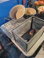 Overall lot showing enamel bowls, dish racks, glass aquarium with plants