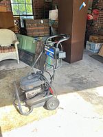 Full side view of Excell gas pressure washer with hose and wand attached