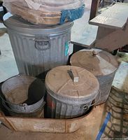 Group shot showing tall trash can, two medium cans, pails and coal scuttle
