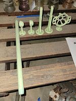 Full set laid out on bench showing rod, brackets, soap dish mount