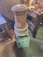 Full view of heater on cabinet stand