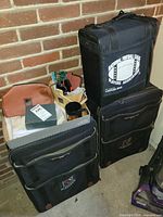 All three Players luggage pieces stacked with mug, toiletry bag, wooden caddy visible
