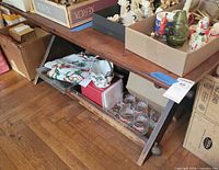 Full view of tabletop, lower shelf, and trestle legs