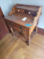 Full view of side table showing drawers, legs, finish