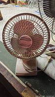 Front view of Tatung desk fan showing blades and grill