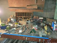 overall workbench view with tools, plumbing parts, vise and organizer visible