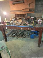 Full view of wooden workbench showing top and lower shelf