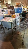 Laundry hamper and wire cart together