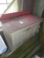 Front and top view of cabinet showing white body and pink top