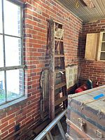 Wood step ladder standing, straight ladder beneath