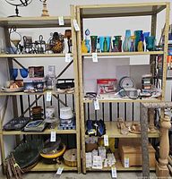 Both metal shelving units filled with miscellaneous items, showing overall design and color