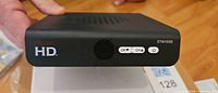 Front view of Access HD converter box showing logo, buttons and model number