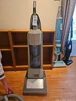 Front view of Amway ClearTrak CMS 1000 upright vacuum standing on floor