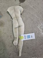 Front view of plaster torso fragment showing antiqued finish and overall form