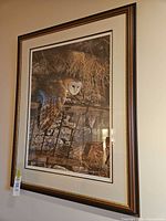 Full view of framed print on wall showing frame, mat, and artwork