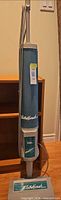Full view of Iona ElectrikBrush upright vacuum cleaner standing vertically