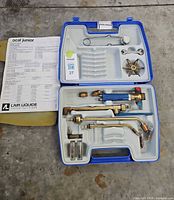 overall view of open case showing entire kit and paperwork