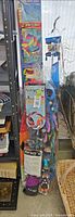 Full lot showing stacked, packaged kites including Air-Yo, Cyclops, Crayon
