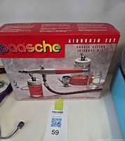 Front view of Paasche airbrush set box