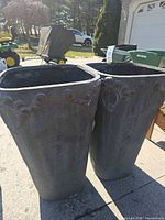 Front view of both planters showing shape and decorative rim