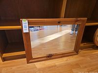 Front view of rectangular pine-framed mirror
