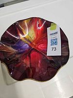 Top view showing multicolour swirl and wavy rim