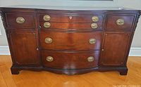 Front view of mahogany buffet showing doors and drawers