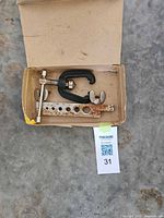 Box opened showing flaring bar, yoke, clamps