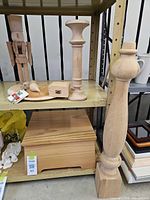 Shelf showing newel post, candlestick, nutcracker, keepsake chest