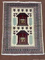 Full view of rug showing design, borders and fringe