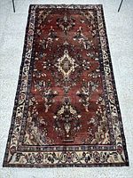 Full view of brown Hamedan rug showing design and size