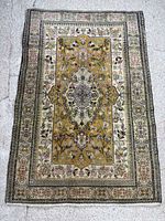 Full view of Tabriz rug showing overall pattern and borders