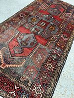 Full view of entire Zanjan rug showing geometric design and borders