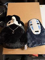Front view of both plush toys