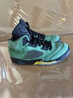 Left and right Nike Air Jordan 5 Retro SE sneakers side view