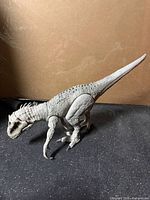 Full left side view of Indominus Rex figure standing