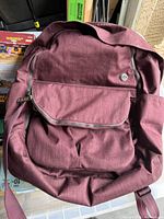 Front view showing color, front zip pocket, logo