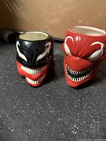 Front view of Venom and Carnage sculpted mugs