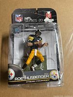 Front view of sealed Ben Roethlisberger NFL Series 20 figure in package