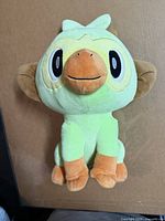 Front view of Grookey plush