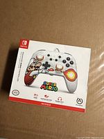 Front of boxed PowerA Super Mario wired controller