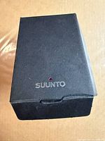 Closed black Suunto outer box