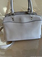 Back view displaying overall condition and pebbled leather texture