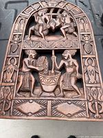 front showing carved African relief and border