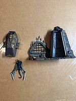 Overall view showing coffin, diorama wall base, claw accessory