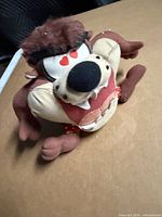 Front view of Tasmanian Devil plush showing heart eyes and shorts