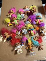Overview of all troll dolls on cardboard