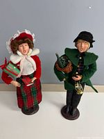 Both Byers Choice caroler figurines standing side by side