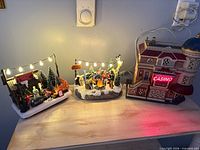 All three lighted winter pieces on tabletop